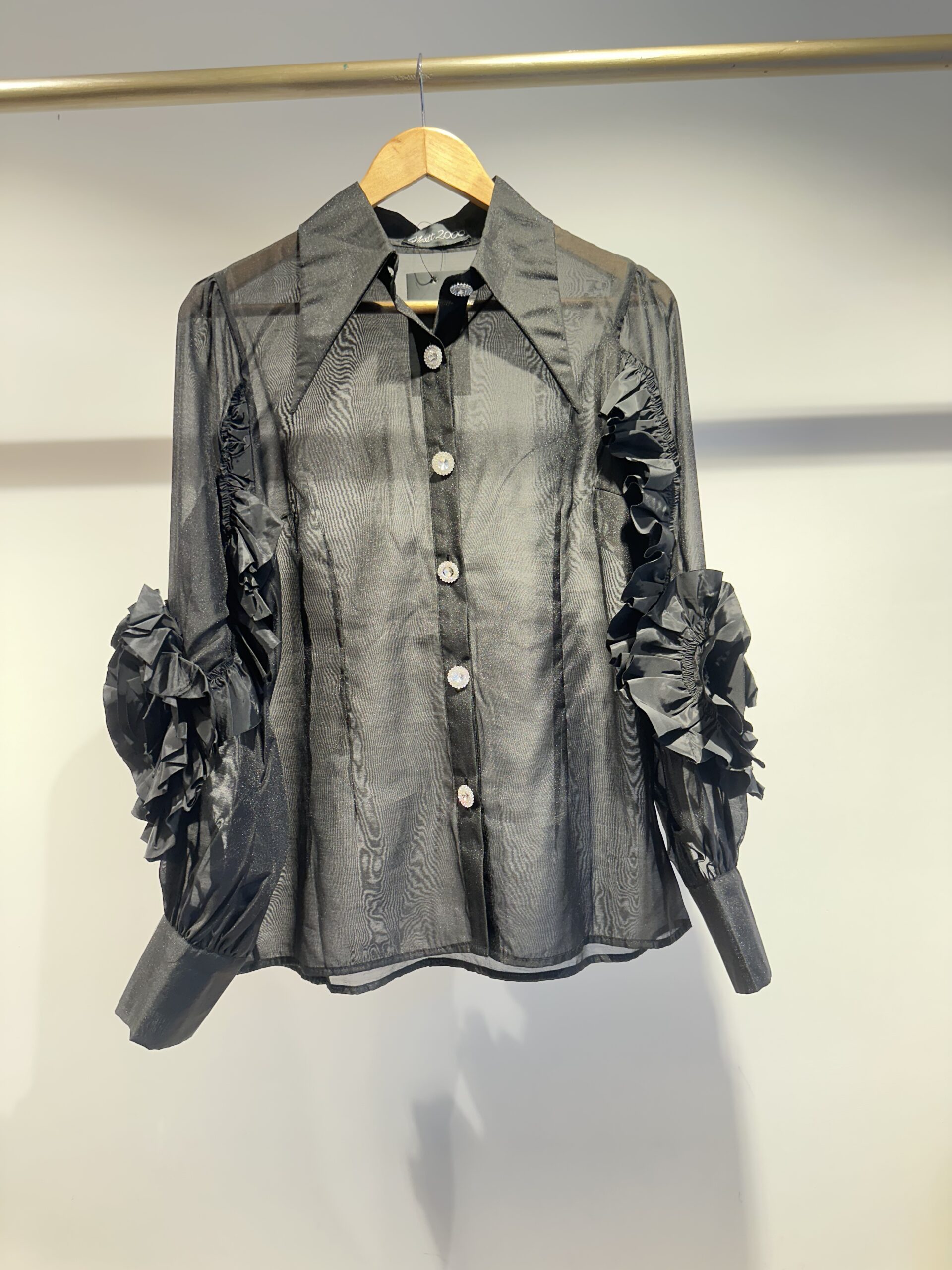 Black full sleeved shirt with diamanté buttons and flower appliqué on sleeve